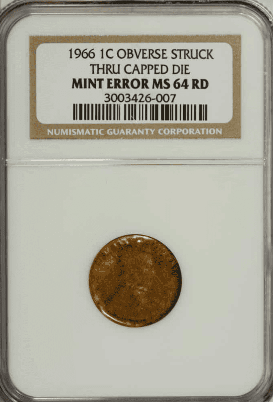 1966 Penny Obverse struck through a capped die